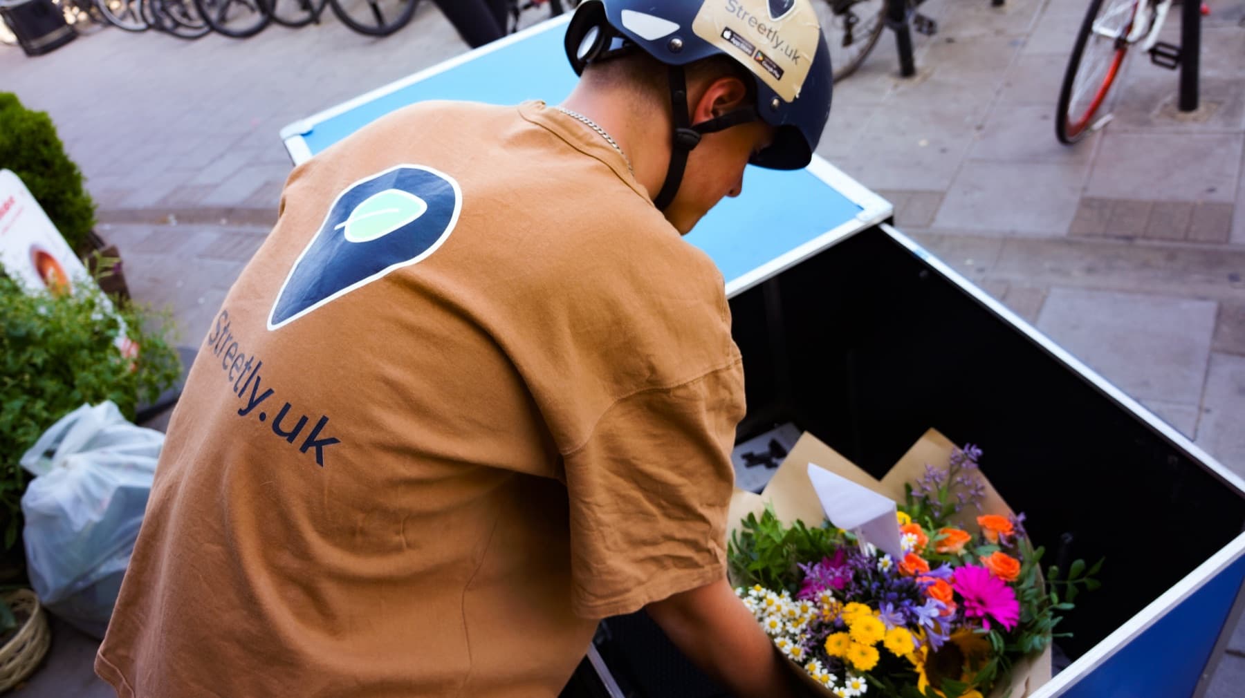 A Streetly rider preparing locally ordered flowers for delivery